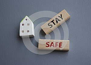 Stay Safe symbol. Concept word Stay Safe on wooden blocks. Beautiful grey background. Business and Stay Safe concept. Copy space