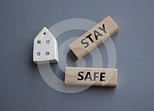 Stay Safe symbol. Concept word Stay Safe on wooden blocks. Beautiful grey background. Business and Stay Safe concept. Copy space