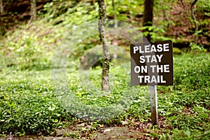 Stay on the trail sign