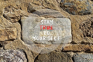 Stay true to yourself symbol. Concept word Stay true to yourself on beautiful beautiful stone. Beautiful stone wall background.