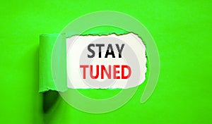 Stay tuned symbol. Concept words Stay tuned on beautiful white paper on a beautiful green background. Business, support,