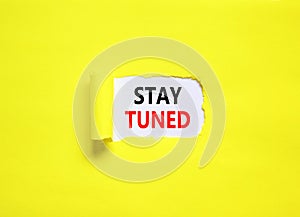 Stay tuned symbol. Concept words Stay tuned on beautiful white paper on a beautiful yellow background. Business, support,