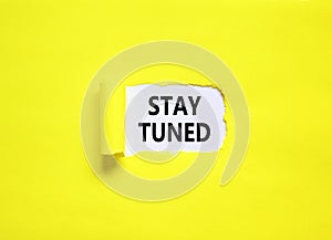 Stay tuned symbol. Concept words Stay tuned on beautiful white paper on a beautiful yellow background. Business, support,