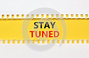 Stay tuned symbol. Concept words Stay tuned on beautiful yellow paper on beautiful white background. Business, support, motivation