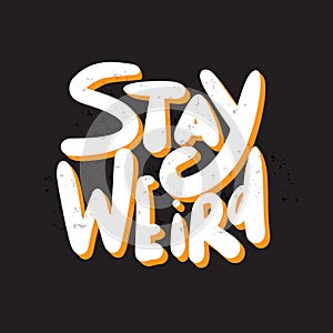 Stay weird. Funny hand lettering quote. White inscription with orange shadow on black background