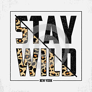 Stay Wild - composite slogan with leopard texture. T-shirt typography print with animal skin. Tee shirt trendy print. Vector.