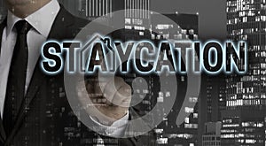 Staycation concept is shown by businessman