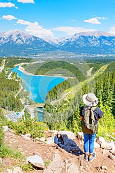 Staycation hike on top of mountain overlooking local town of Canmore and Kananaskis