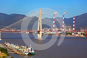 Stayed-cable bridge and boatyard photo