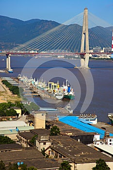 Stayed-cable bridge and boatyard photo