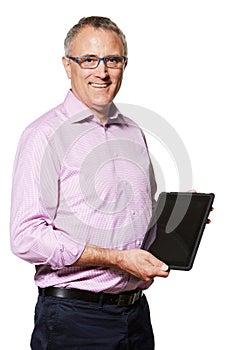 Staying abreast of new technology. Studio portrait of a mature man holding up a digital tablet with a blank screen.