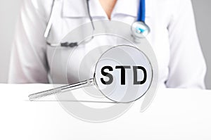 STD acronym, medical disease through magnifier