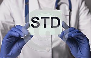 STD acronym, word. Medical disease in doctor hands