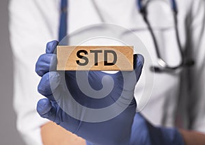 STD acronym, word. Medical disease in doctor hands