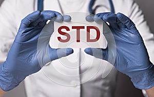 STD acronym, word. Medical disease in doctor hands