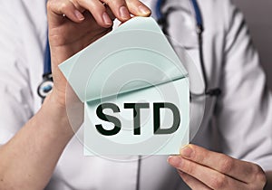 STD acronym, word. Medical disease in doctor hands