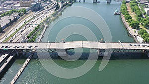 steady flight above river Willamette with Burnside Bridge just closing the double-leafs bascule - traffic is still waiting
