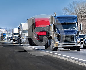 Steady Stream of Trucks Rolls Down The Interstate Highway