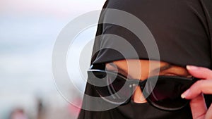 Steadycam - Woman with chador, hijab wearing sunglasses, istanbul