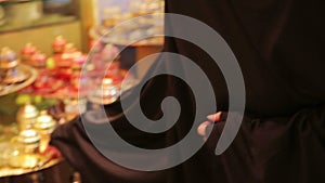 Steadycam - Woman with headscarf shopping at Grand Bazaar, Istanbul, Turkey