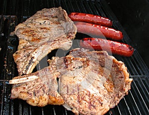 Steak and Bratwurst on a Grill