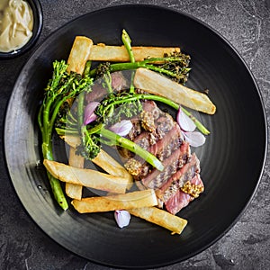 Steak and Chips with Broccolini Mustart Shallots and Bernaise Sauce Top View