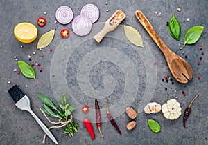 Steak concept with dark stone background. Ingredients for making steak with copy space . Various herbs and seasoning rosemary ,