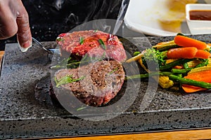 Steak cooked on lava-stone