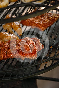 Steak cooking over flaming grill