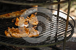 Steak cooking over flaming grill