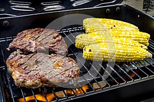 Steak and Corn on Hot Grill