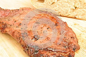Steak on cutting board upclose