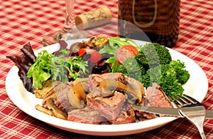 Steak dinner, salad and wine