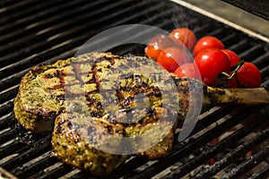 Steak flame broiled on a barbecue