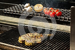 Steak flame broiled on a barbecue