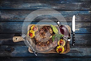 Steak fried tibon with corn and wine sauce on the table.