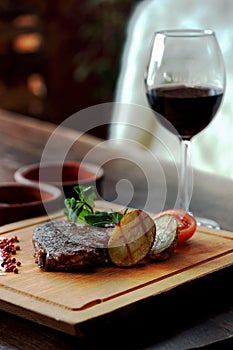 Steak and grilled vegetables photo