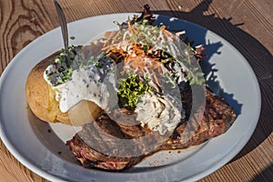 Steak, jacket potato and salad