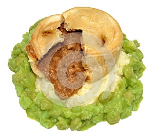 Steak And Kidney Pudding With Mashed Potato And Peas