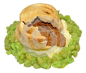 Steak And Kidney Pudding With Mashed Potato And Peas