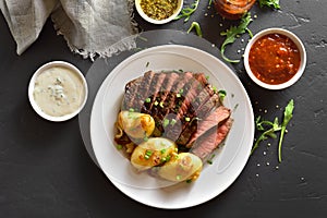 Steak medium rare beef with baked potatoes