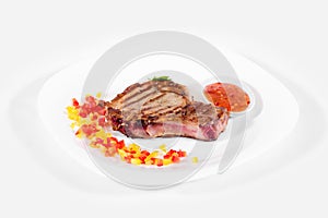 Steak on a plate on a white background