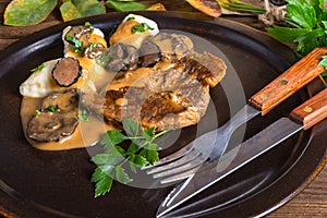 Steak with potato dumplings and forest mushroom sauce