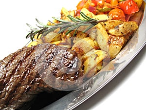 Steak, potatoes and vegetables