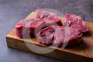 Steak. Raw beef steak. Fresh raw Sirloin beef steak sliced o Herb - Rosemary decoration