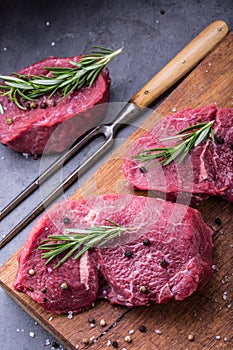 Steak. Raw beef steak. Fresh raw Sirloin beef steak sliced o Herb - Rosemary decoration