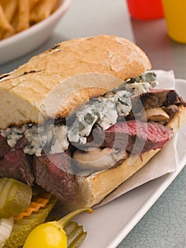 Steak and Roquefort Sandwich with Fries Gherkins