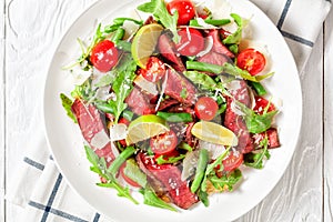 Steak salad of beef sirloin with cherry tomatoes