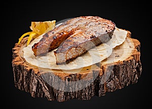Steak from salmon on a wooden slice photo