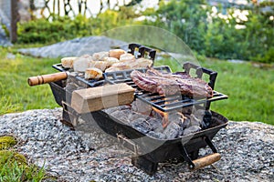 Steak and Scallops grilling on a hibachi on a summer night